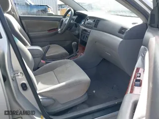 2004 Toyota Corolla CE with VIN 1NXBR38E34Z277929, listed as a IAAI auction lot 41807213 with 197,757 mi miles. Bid and sale history available at carsss.com. Image 5.