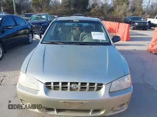 2000 Hyundai Accent z VIN KMHCG45G3YU034438, wystawiony jako IAAI lot #41356583 z przebiegiem 57 283 mil mil oraz . Historia ofert i sprzedaży dostępna na DreamBid. Obrazek 6.