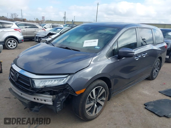 2022 Honda Odyssey Touring with VIN 5FNRL6H80NB023623, listed as a IAAI auction lot 41512586 with 63,329 mi miles and . Bid and sale history available at DreamBid. Image 2.