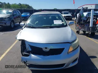 2009 Toyota Corolla with VIN 1NXBU40E99Z100681, listed as a IAAI auction lot 41973116 with 119,744 mi miles. Bid and sale history available at carsss.com. Image 12.