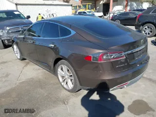 2013 Tesla Model S with VIN 5YJSA1DN4DFP19552, listed as a IAAI auction lot 41360466 with 129,806 mi miles. Bid and sale history available at carsss.com. Image 3.