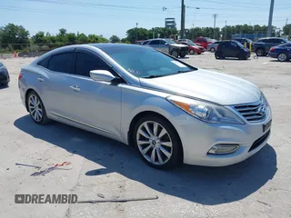 2013 Hyundai Azera z VIN KMHFH4JG6DA321882, wystawiony jako IAAI lot #42351891 z przebiegiem 59 690 mil mil oraz . Historia ofert i sprzedaży dostępna na DreamBid. Obrazek 1.