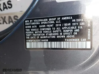 2013 Volkswagen Passat SE with VIN 1VWBP7A32DC144639, listed as a IAAI auction lot 41337338 with 147,878 mi miles. Bid and sale history available at carsss.com. Image 9.