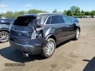 2018 Cadillac XT5 AWD with VIN 1GYKNBRS8JZ203963, listed as a Copart auction lot 57243165 with 18,407 mi miles and Salvage title. Bid and sale history available at DreamBid. Image 3.