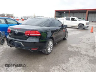 2014 Volkswagen Eos Komfort with VIN WVWBW8AH4EV007229, listed as a IAAI auction lot 41894160 with 66,984 mi miles and . Bid and sale history available at DreamBid. Image 4.