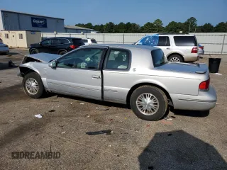 1997 Mercury Cougar z VIN 1MELM6245VH627028, wystawiony jako Copart lot #65533884 z przebiegiem 74 360 mil mil oraz Szkody całkowita. Historia ofert i sprzedaży dostępna na DreamBid. Obrazek 2.