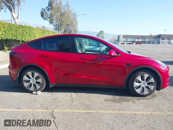 2020 Tesla Model Y Long Range with VIN 5YJYGDEE8LF057014, listed as a IAAI auction lot 41988113 with 18,246 mi miles and . Bid and sale history available at DreamBid. Image 14.