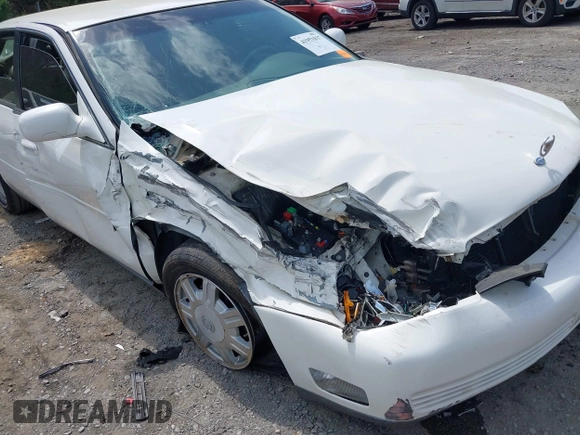 2004 Cadillac DeVille z VIN 1G6KD54YX4U181779, wystawiony jako IAAI lot #41951837 z przebiegiem Nie podano mil oraz . Historia ofert i sprzedaży dostępna na DreamBid. Obrazek 6.