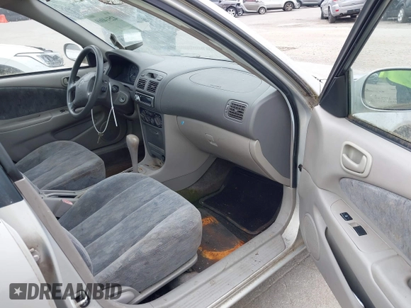 1999 Toyota Corolla VE z VIN 2T1BR12E7XC154444, wystawiony jako IAAI lot #42514069 z przebiegiem 209 377 mil mil oraz . Historia ofert i sprzedaży dostępna na DreamBid. Obrazek 5.