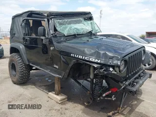 2004 Jeep Wrangler Rubicon z VIN 1J4FA69S84P727716, wystawiony jako IAAI lot #42162129 z przebiegiem 90 844 mil mil oraz . Historia ofert i sprzedaży dostępna na DreamBid. Obrazek 1.