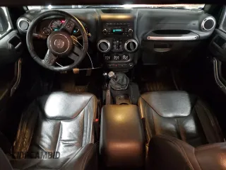 2015 Jeep Wrangler Unlimited Sahara with VIN 1C4BJWEG5FL611521, listed as a Copart auction lot 50609985 with 207,473 mi miles and Salvage Title. Bid and sale history available at carsss.com. Image 8.
