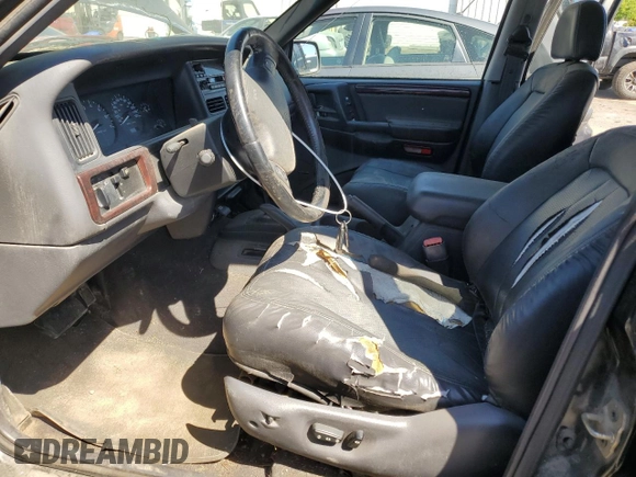 1998 Jeep Grand Cherokee Laredo with VIN 1J4GZ58Y4WC109610, listed as a Copart auction lot 58705124 with 247,990 mi miles and Salvage Title. Bid and sale history available at carsss.com. Image 7.