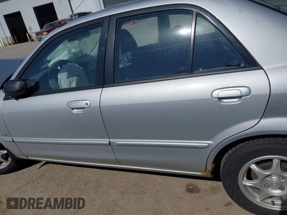 2000 Mazda Protege DX with VIN JM1BJ2227Y0240819, listed as a IAAI auction lot 41810228 with 68,650 mi miles and . Bid and sale history available at DreamBid. Image 14.