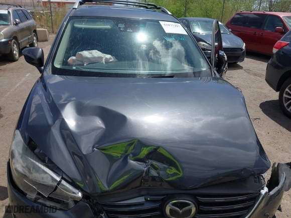2016 Mazda CX-5 Grand Touring with VIN JM3KE4DY7G0643643, listed as a IAAI auction lot 42077497 with 120,343 mi miles. Bid and sale history available at carsss.com. Image 10.