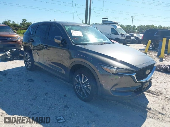 2018 Mazda CX-5 Grand Touring with VIN JM3KFBDM8J0314925, listed as a IAAI auction lot 41825917 with 70,027 mi miles. Bid and sale history available at carsss.com. Image 1.