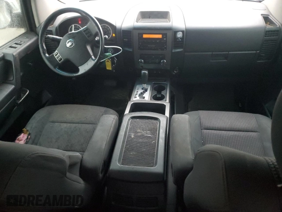 2010 Nissan Titan SE with VIN 1N6BA0ED7AN324632, listed as a Copart auction lot 57095185 with 156,391 mi miles and Salvage title. Bid and sale history available at DreamBid. Image 8.