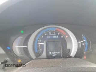 2011 Honda Insight EX with VIN JHMZE2H77BS006079, listed as a Copart auction lot 63873985 with 134,159 mi miles and Salvage title. Bid and sale history available at DreamBid. Image 9.