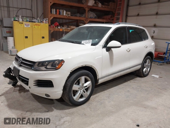 2011 Volkswagen Touareg Sport with VIN WVGFF9BP8BD004747, listed as a IAAI auction lot 41780515 with 159,228 mi miles and . Bid and sale history available at DreamBid. Image 2.