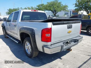 2013 Chevrolet Silverado 1500 LT with VIN 3GCPKSE71DG203443, listed as a IAAI auction lot 42033447 with 128,904 mi miles. Bid and sale history available at carsss.com. Image 3.