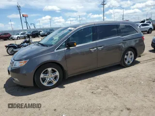 2011 Honda Odyssey Touring with VIN 5FNRL5H94BB095987, listed as a Copart auction lot 57964315 with 136,595 mi miles and Salvage title. Bid and sale history available at DreamBid. Image 1.