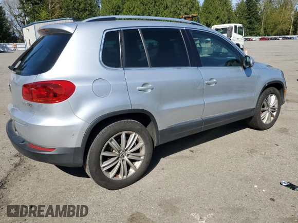 2012 Volkswagen Tiguan SE z VIN WVGAV7AXXCW513800, wystawiony jako Copart lot #53005945 z przebiegiem 155 920 mil mil oraz Tytuł czysty. Historia ofert i sprzedaży dostępna na DreamBid. Obrazek 3.