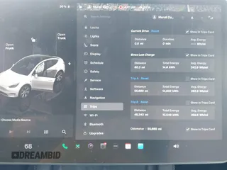 2022 Tesla Model Y Long Range z VIN 7SAYGDEE6NF419332, wystawiony jako IAAI lot #42020974 z przebiegiem 55 680 mil mil oraz . Historia ofert i sprzedaży dostępna na DreamBid. Obrazek 7.