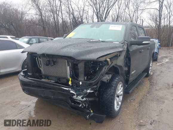 2021 Ram 1500 Laramie with VIN 1C6SRFJT6MN580803, listed as a IAAI auction lot 41207914 with 56,891 mi miles and . Bid and sale history available at DreamBid. Image 2.