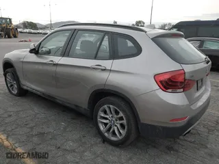 2015 BMW X1 xDrive28i with VIN WBAVL1C55FVY41749, listed as a IAAI auction lot 40977221 with 120,924 mi miles. Bid and sale history available at carsss.com. Image 3.