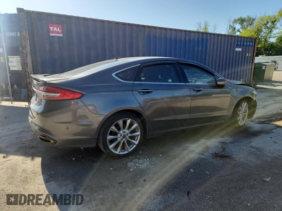 2017 Ford Fusion Titanium z VIN 3FA6P0D96HR251752, wystawiony jako Copart lot #61568705 z przebiegiem 173 479 mil mil oraz Nie do naprawy • Non repairable. Historia ofert i sprzedaży dostępna na DreamBid. Obrazek 3.