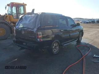 2003 Cadillac Escalade z VIN 1GYEK63N63R196238, wystawiony jako IAAI lot #41426210 z przebiegiem 296 853 mil mil oraz . Historia ofert i sprzedaży dostępna na DreamBid. Obrazek 4.