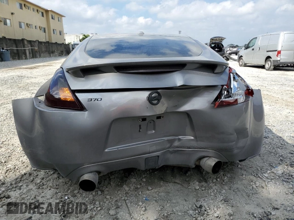 2009 Nissan 370Z z VIN JN1AZ44E69M405389, wystawiony jako Copart lot #43340975 z przebiegiem 31 521 mil mil oraz Szkoda całkowita • Salvage title. Historia ofert i sprzedaży dostępna na DreamBid. Obrazek 6.