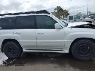 2004 Lexus LX 470 z VIN JTJHT00W043543915, wystawiony jako IAAI lot #41902858 z przebiegiem 110 454 mil mil oraz . Historia ofert i sprzedaży dostępna na DreamBid. Obrazek 14.