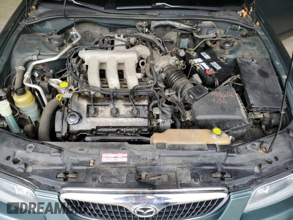 2000 Mazda Millenia z VIN JM1TA2212Y1610919, wystawiony jako Copart lot #80375014 z przebiegiem 127 938 mil mil oraz Szkoda całkowita • Salvage title. Historia ofert i sprzedaży dostępna na DreamBid. Obrazek 13.