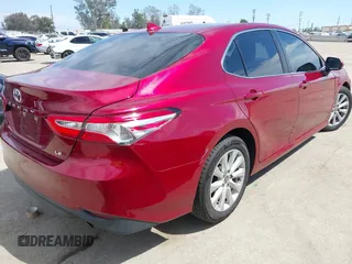 2020 Toyota Camry LE with VIN 4T1C11AK9LU991305, listed as a IAAI auction lot 41976371 with 57,422 mi miles and . Bid and sale history available at carsss.com. Image 4.