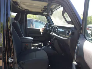 2023 Jeep Wrangler Sahara with VIN 1C4HJXEN5PW702268, listed as a IAAI auction lot 42288704 with 57,240 mi miles and . Bid and sale history available at DreamBid. Image 5.