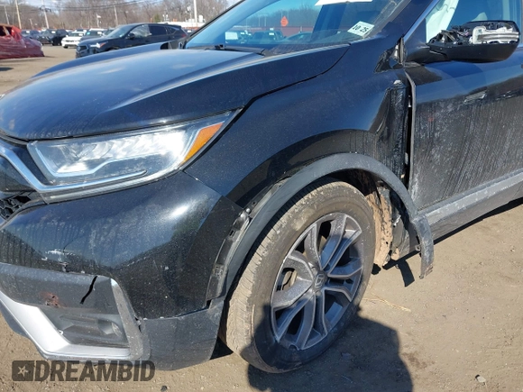 2020 Honda CR-V Touring with VIN 2HKRW2H98LH626651, listed as a IAAI auction lot 41668951 with 64,391 mi miles and . Bid and sale history available at DreamBid. Image 6.