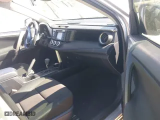 2018 Toyota RAV4 LE with VIN JTMZFREVXJJ196183, listed as a IAAI auction lot 41776107 with 82,713 mi miles. Bid and sale history available at carsss.com. Image 5.