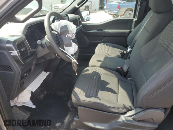 2023 Ford F-150 XL with VIN 1FTEX1EP9PKE34381, listed as a Copart auction lot 63938505 with 13,933 mi miles and Salvage title. Bid and sale history available at DreamBid. Image 7.