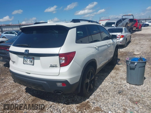 2019 Honda Passport Elite z VIN 5FNYF8H0XKB000774, wystawiony jako IAAI lot #42153669 z przebiegiem 65 415 mil mil oraz . Historia ofert i sprzedaży dostępna na DreamBid. Obrazek 4.