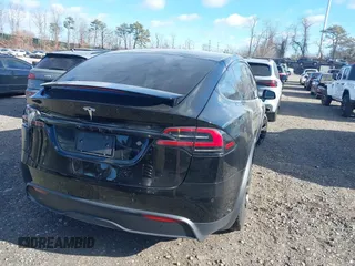 2023 Tesla Model X with VIN 7SAXCAE59PF377408, listed as a IAAI auction lot 41176738 with 32,496 mi miles and . Bid and sale history available at DreamBid. Image 4.