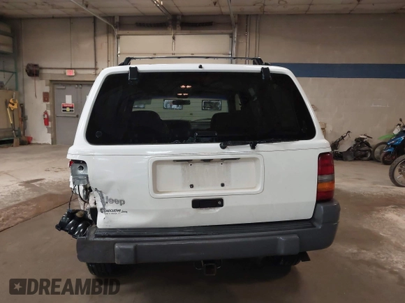 1997 Jeep Grand Cherokee Laredo z VIN 1J4GZ58S9VC562907, wystawiony jako IAAI lot #42102313 z przebiegiem 137 672 mil mil oraz . Historia ofert i sprzedaży dostępna na DreamBid. Obrazek 16.