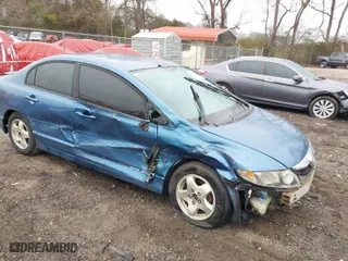 2011 Honda Civic Sdn LX with VIN 19XFA1F57BE038464, listed as a IAAI auction lot 41554157 with 140,466 mi miles. Bid and sale history available at carsss.com. Image 1.