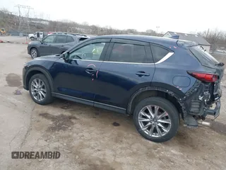 2021 Mazda CX-5 Grand Touring with VIN JM3KFADM0M1321375, listed as a IAAI auction lot 41913449 with 88,178 mi miles. Bid and sale history available at carsss.com. Image 3.