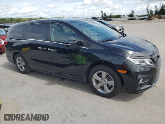 2018 Honda Odyssey EX-L z VIN 5FNRL6H7XJB031245, wystawiony jako Copart lot #59331635 z przebiegiem 74 901 mil mil oraz Czysty tytuł • Clean title. Historia ofert i sprzedaży dostępna na DreamBid. Obrazek 4.