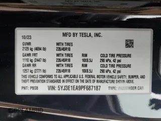 2023 Tesla Model 3 with VIN 5YJ3E1EA9PF687187, listed as a Copart auction lot 61044055 with 7,007 mi miles and Salvage title. Bid and sale history available at DreamBid. Image 13.