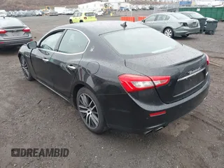 2017 Maserati Ghibli with VIN ZAM57XSA3H1197716, listed as a IAAI auction lot 41918916 with 47,779 mi miles. Bid and sale history available at carsss.com. Image 3.