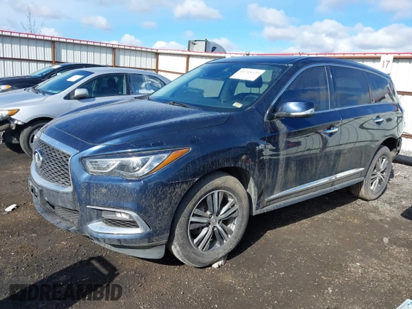 2020 Infiniti QX60 Luxe with VIN 5N1DL0MM0LC530960, listed as a IAAI auction lot 41718329 with 89,446 mi miles and . Bid and sale history available at DreamBid. Image 2.