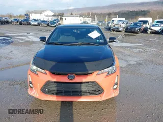 2015 Scion tC with VIN JTKJF5C77FJ008276, listed as a IAAI auction lot 41679236 with 90,987 mi miles. Bid and sale history available at carsss.com. Image 12.