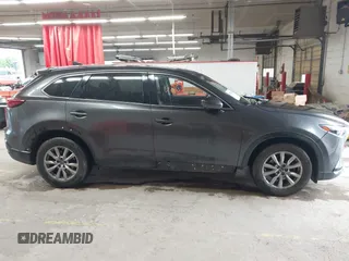 2017 Mazda CX-9 Touring with VIN JM3TCBCY1H0127229, listed as a IAAI auction lot 42320263 with 85,890 mi miles and . Bid and sale history available at DreamBid. Image 13.