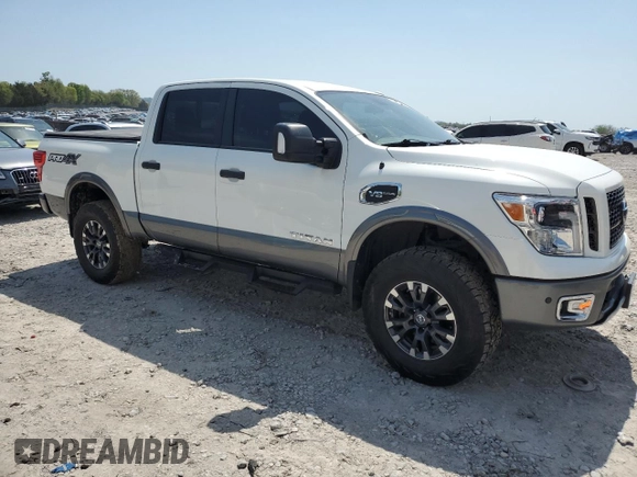 2017 Nissan Titan SV with VIN 1N6AA1E53HN570453, listed as a Copart auction lot 52941025 with 146,705 mi miles and Salvage title. Bid and sale history available at DreamBid. Image 4.